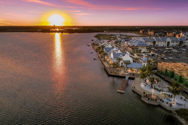 aerial view at dusk with a water view