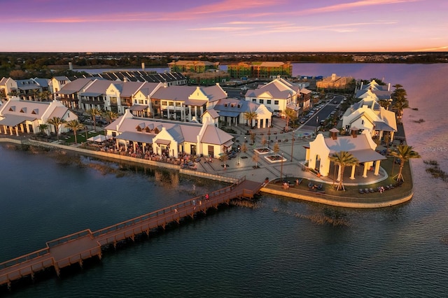 aerial view at dusk with a water view