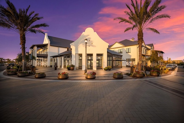 view of outdoor building at dusk