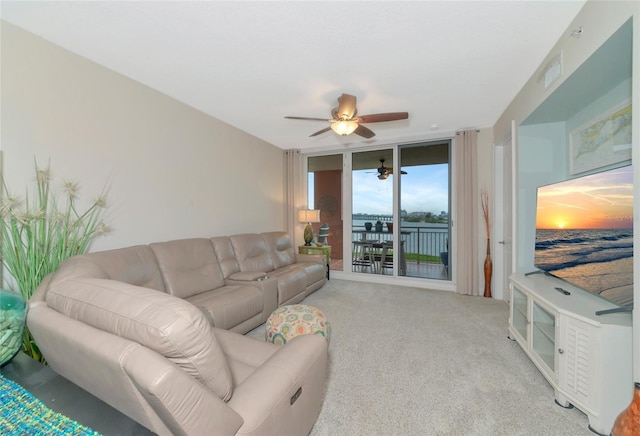 living room with expansive windows and light colored carpet