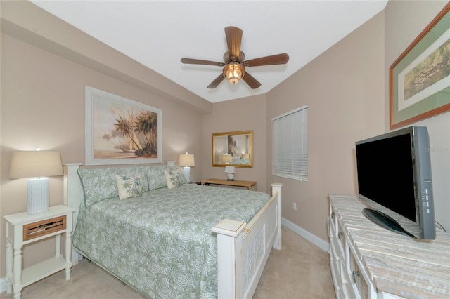 bedroom featuring ceiling fan and light carpet