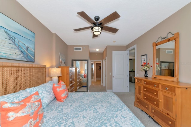 bedroom with light colored carpet and ceiling fan