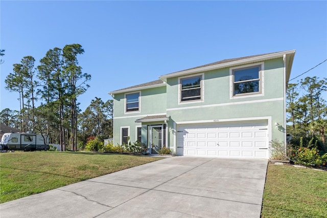 view of front of house with a front yard and a garage