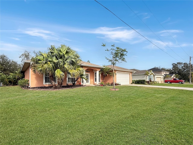 ranch-style home with a garage and a front lawn