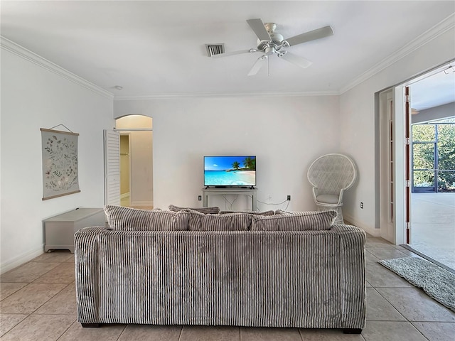 living room featuring ceiling fan, crown molding, and light tile patterned flooring