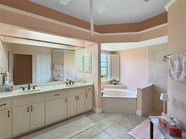 bathroom featuring tile patterned flooring, vanity, and a bath