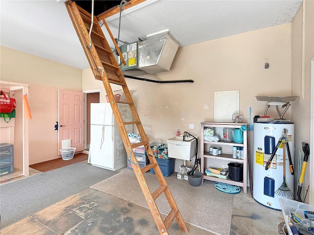 garage featuring water heater and white refrigerator