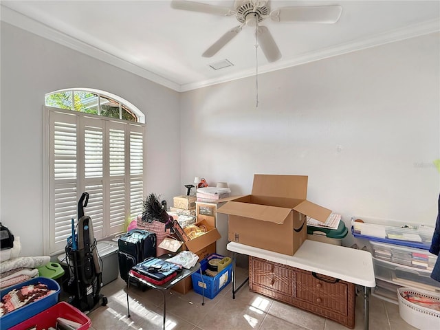 tiled office space with ceiling fan and ornamental molding