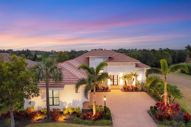 mediterranean / spanish-style home with french doors