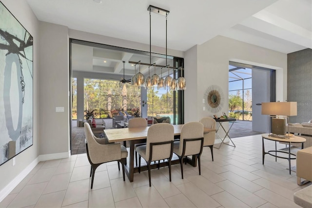 dining room with a healthy amount of sunlight and coffered ceiling