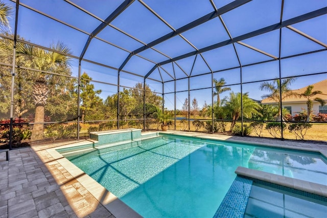 view of pool featuring glass enclosure