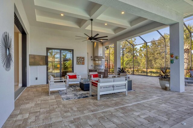 view of patio featuring a grill, an outdoor living space, ceiling fan, and glass enclosure