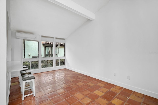 tiled empty room featuring vaulted ceiling with beams, baseboards, and an AC wall unit