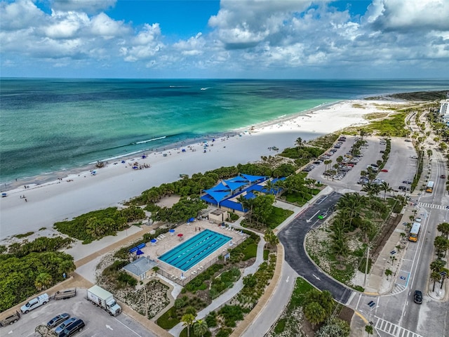 bird's eye view featuring a view of the beach and a water view