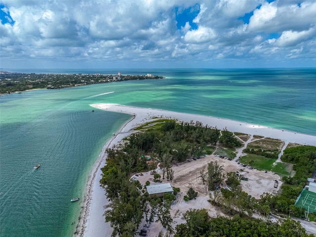 drone / aerial view featuring a water view and a beach view