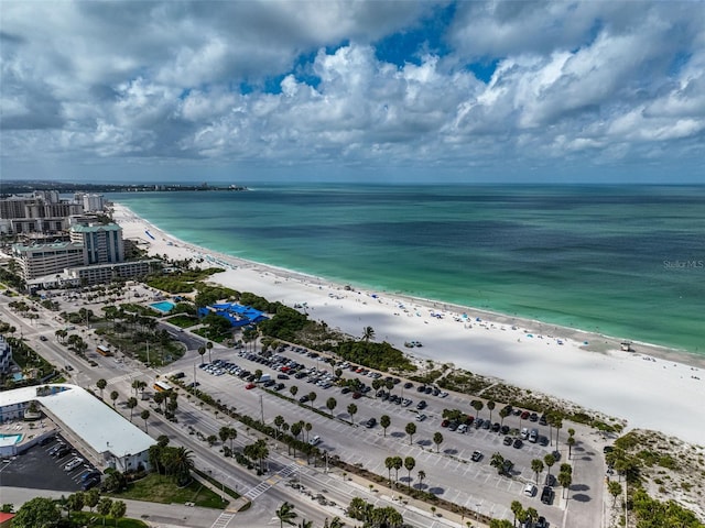 drone / aerial view featuring a water view and a beach view