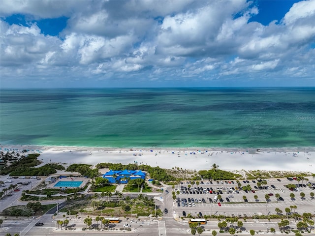 aerial view with a water view and a view of the beach