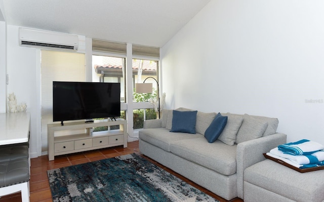 living area with lofted ceiling, an AC wall unit, and dark tile patterned floors