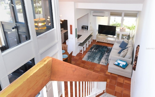 living area featuring dark tile patterned flooring