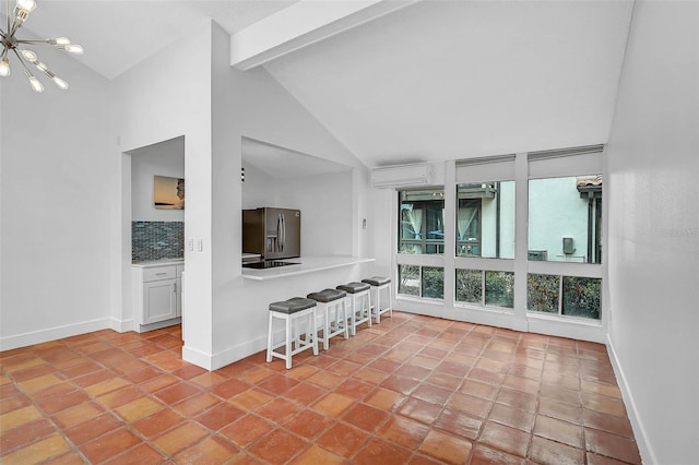 800 S Blvd Of Presidents Unit 12, Sarasota, FL 34236 - sunroom featuring a chandelier and a wall mounted air conditioner