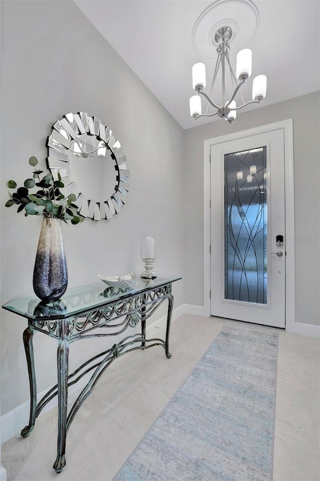 foyer featuring an inviting chandelier