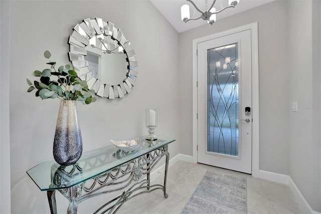 entryway featuring a chandelier