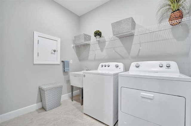 clothes washing area featuring washing machine and clothes dryer