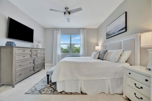 tiled bedroom with ceiling fan