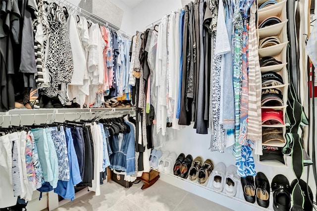 spacious closet featuring tile patterned flooring