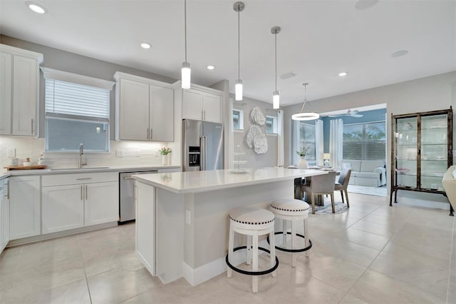 kitchen featuring sink, a center island, and appliances with stainless steel finishes