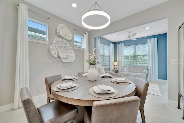 tiled dining area featuring ceiling fan