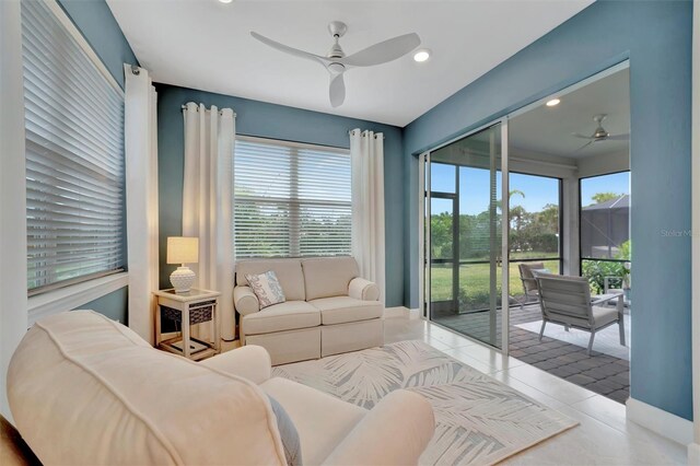 tiled living room with ceiling fan