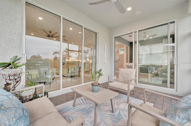 sunroom / solarium with ceiling fan