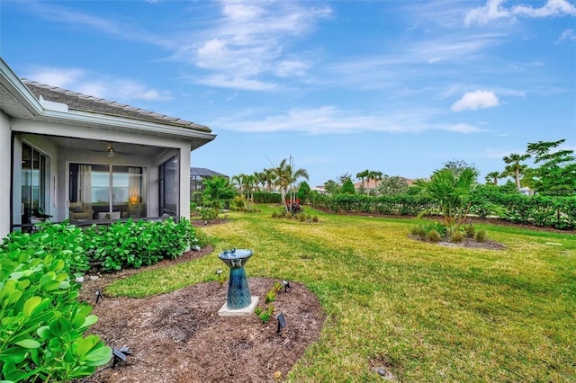 view of yard featuring glass enclosure