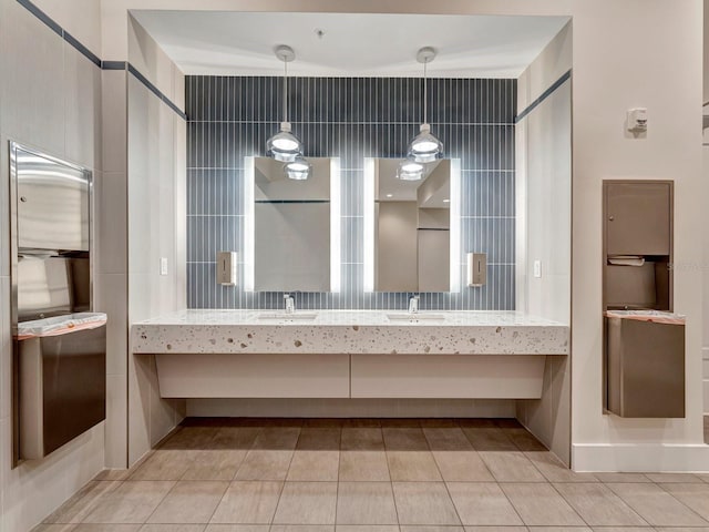 bathroom with tile patterned flooring and vanity