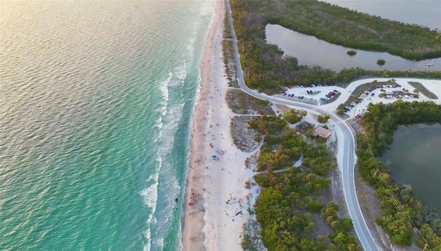 aerial view featuring a water view and a view of the beach