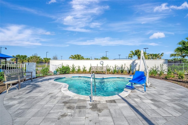 view of pool featuring a patio area