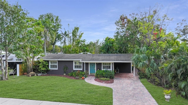 ranch-style home with a front lawn and a carport