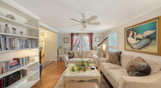 living room with parquet flooring, french doors, ceiling fan, and crown molding