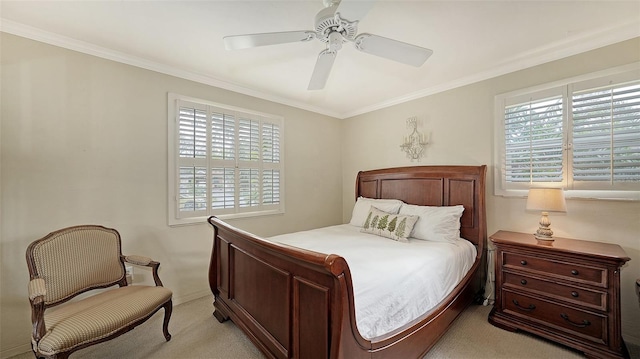 bedroom with ceiling fan, light carpet, and multiple windows