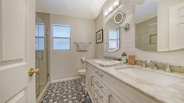 bathroom with tile patterned floors, plenty of natural light, a shower with door, and toilet