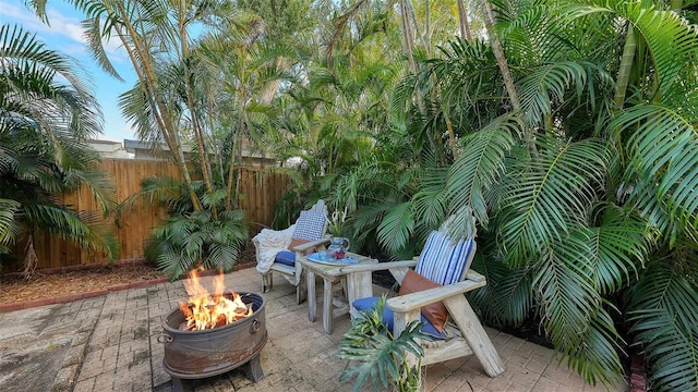 view of patio with an outdoor fire pit