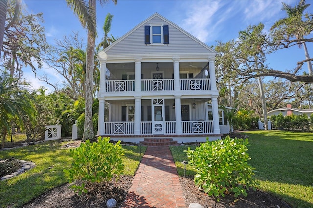 neoclassical / greek revival house with a front lawn