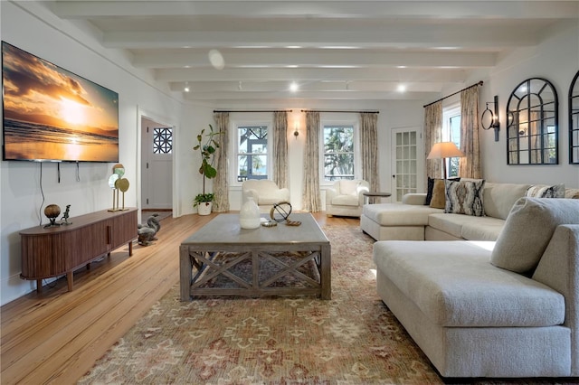 living room featuring beam ceiling and wood-type flooring