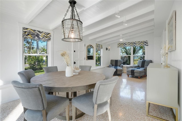 dining area with lofted ceiling with beams, ceiling fan, and a healthy amount of sunlight