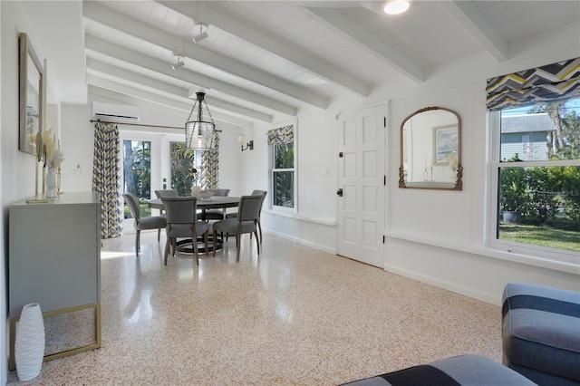 dining area featuring a wall mounted AC and beam ceiling