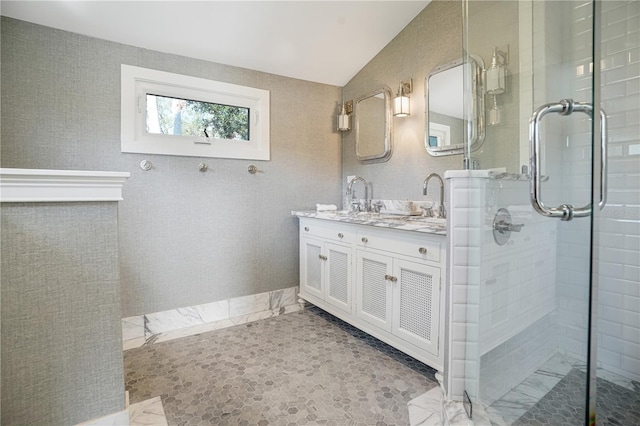 bathroom with an enclosed shower and vanity