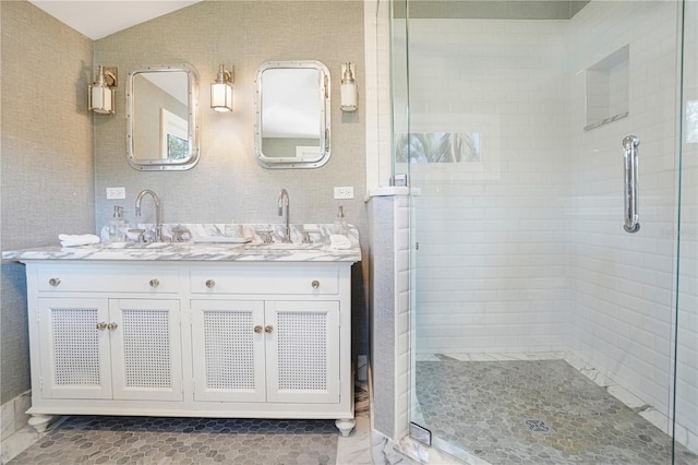 bathroom with an enclosed shower and vanity