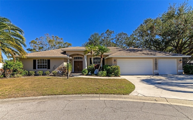 single story home with a front lawn and a garage