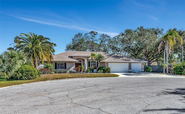 ranch-style home with a garage